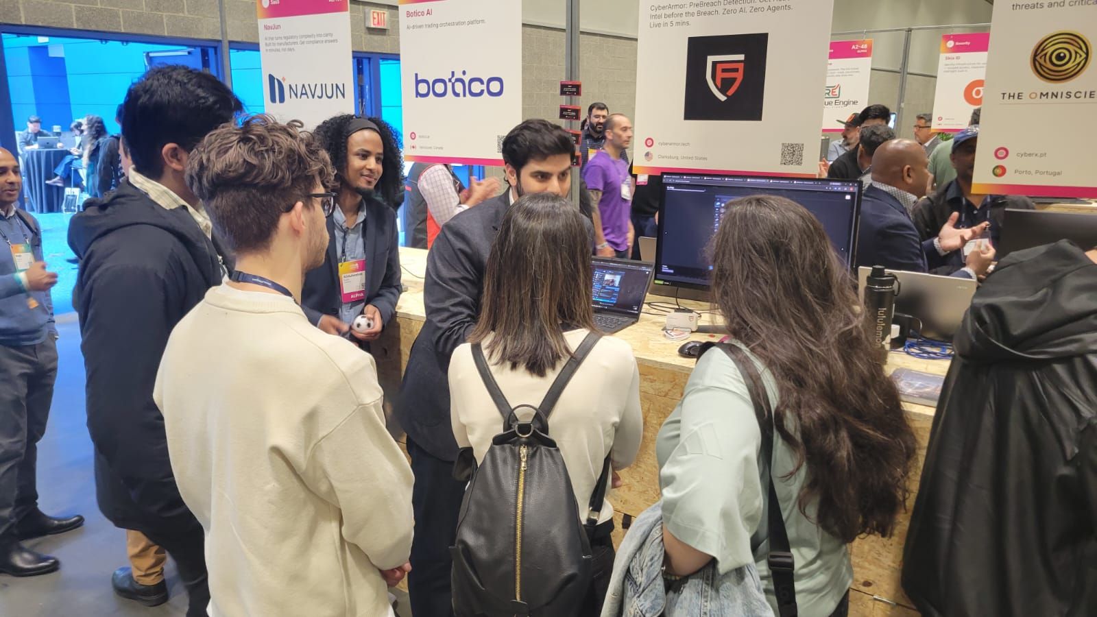 Web Summit Vancouver attendees engaging with CyberArmor demo
